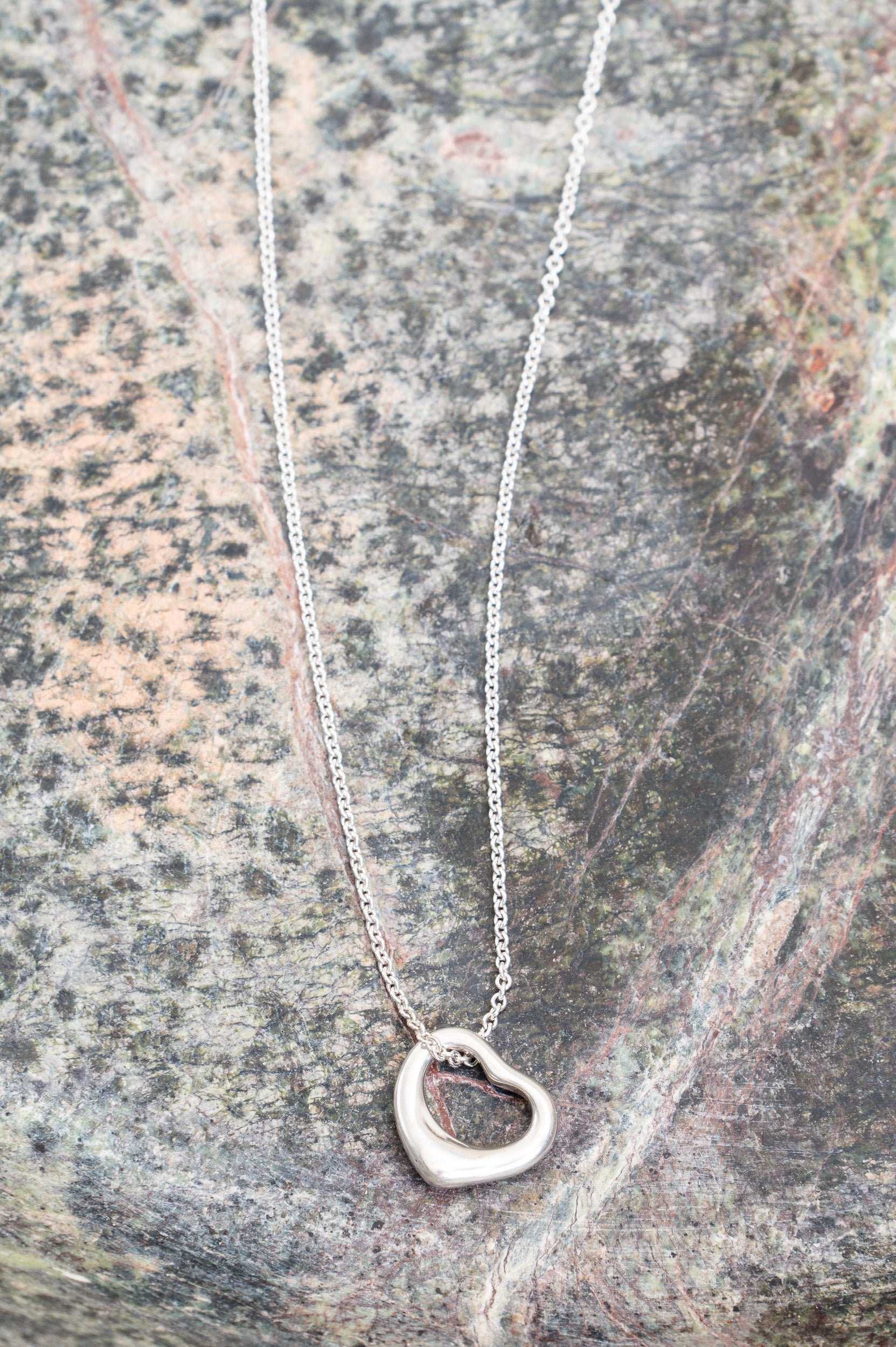 Additional close-up of the open heart pendant on Tiffany & Co. Medium Open Heart Necklace in sterling silver
