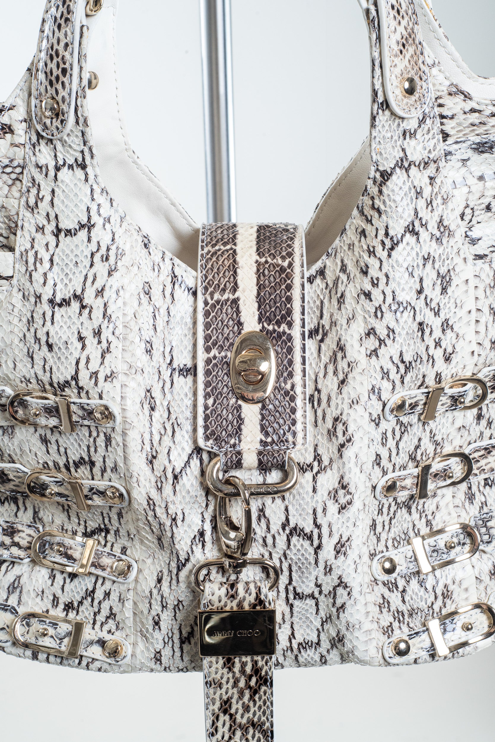Close-up view of Jimmy Choo Bree Snakeskin Tote in white, grey, and black