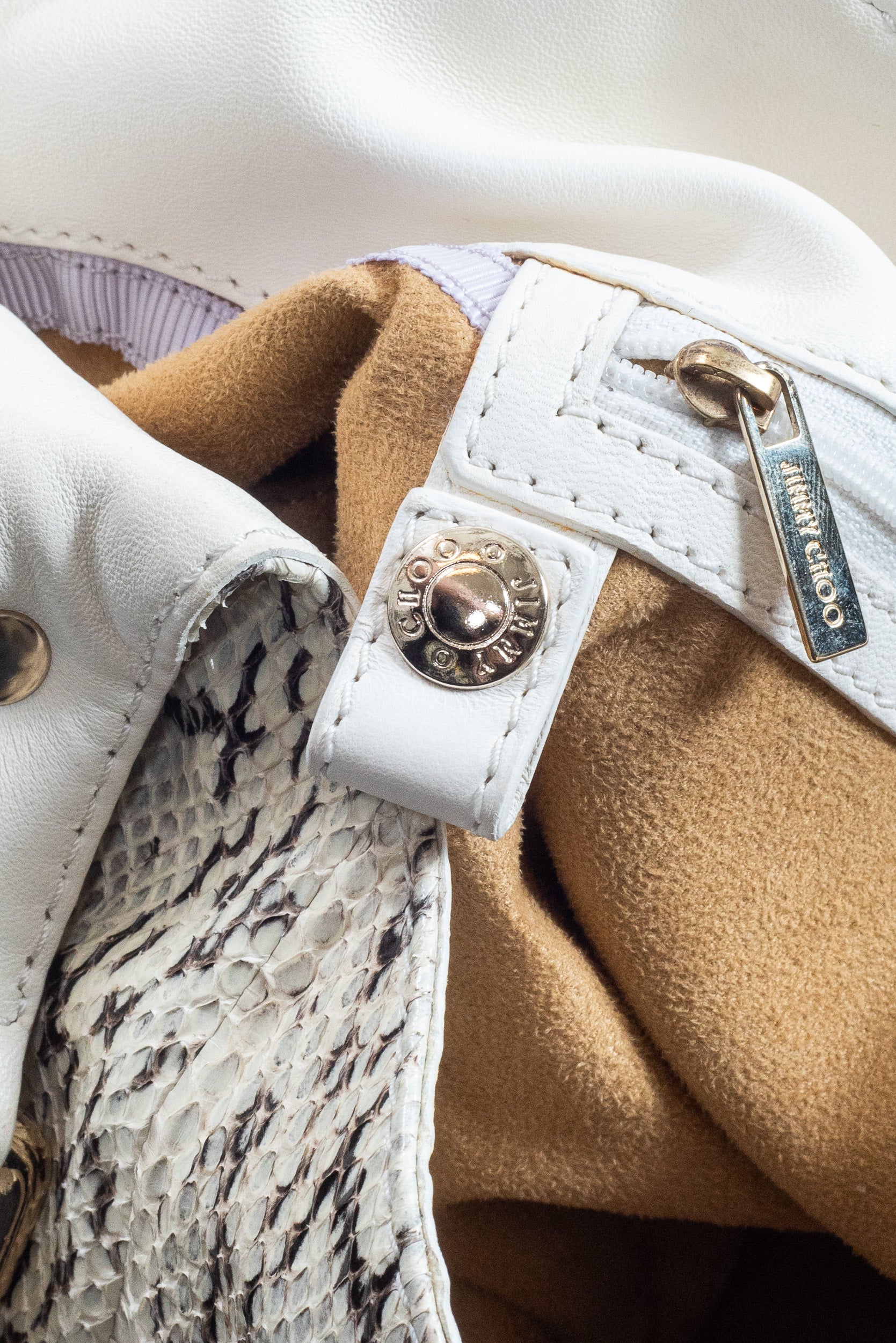 Close-up of metal hardware on Jimmy Choo Bree Tote