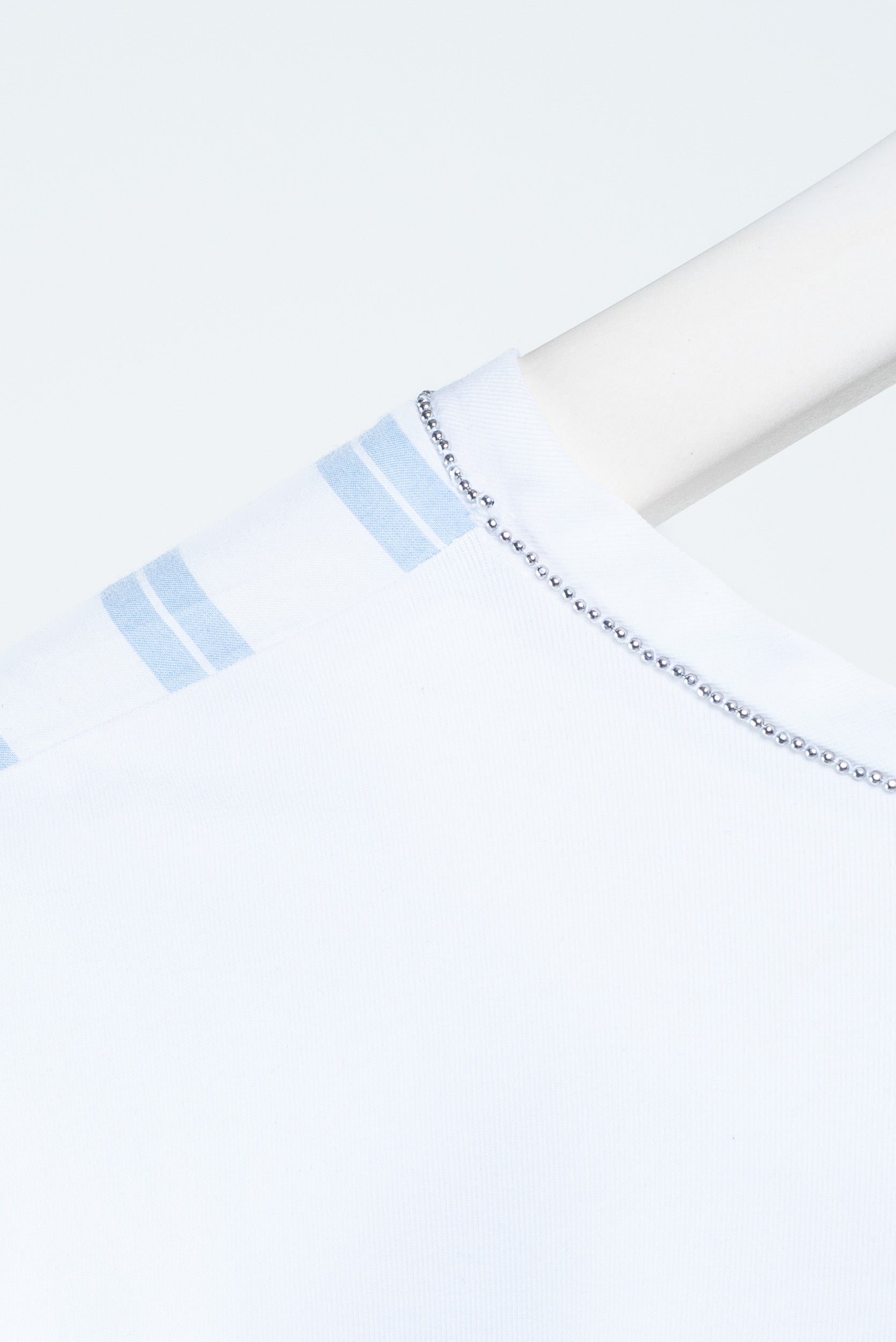 Close-up view of D. Exterior Blue and White Striped Tank Top with silver detail