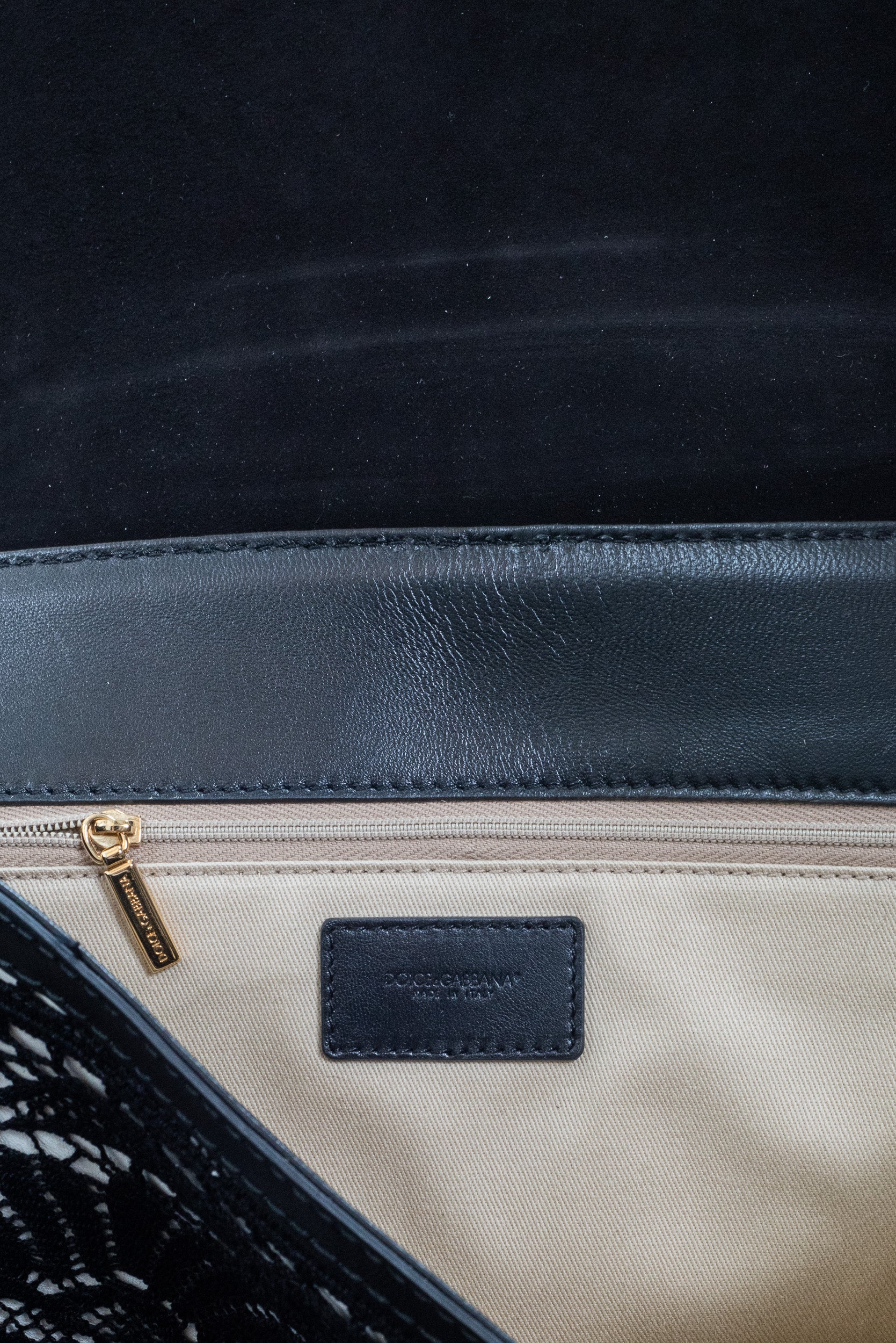 Interior view of Dolce & Gabbana Miss Sicily Shoulder Bag showing zipper pocket and canvas lining detail