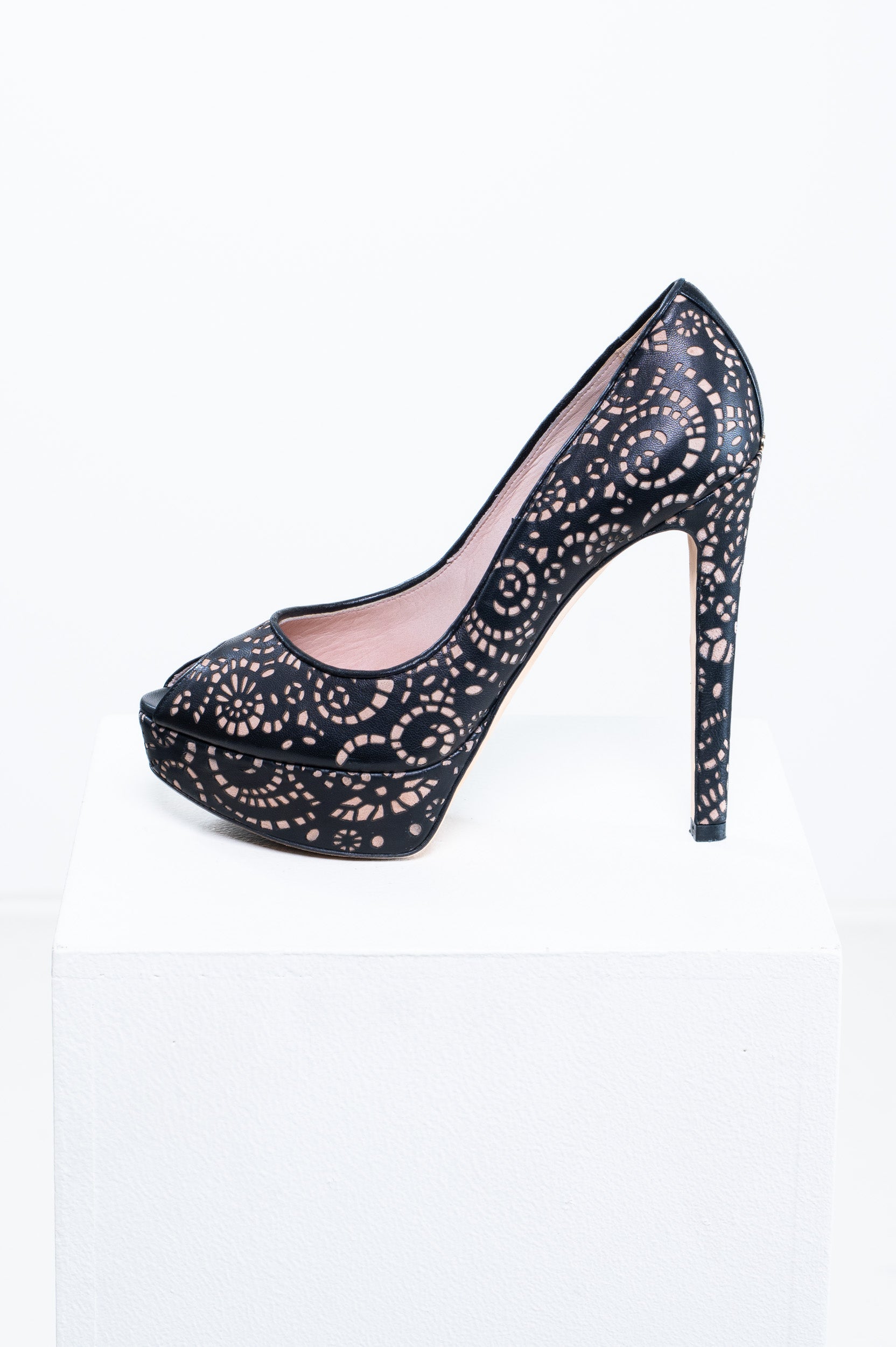Side angle of Christian Dior Leather Laser Cut Accent Pumps