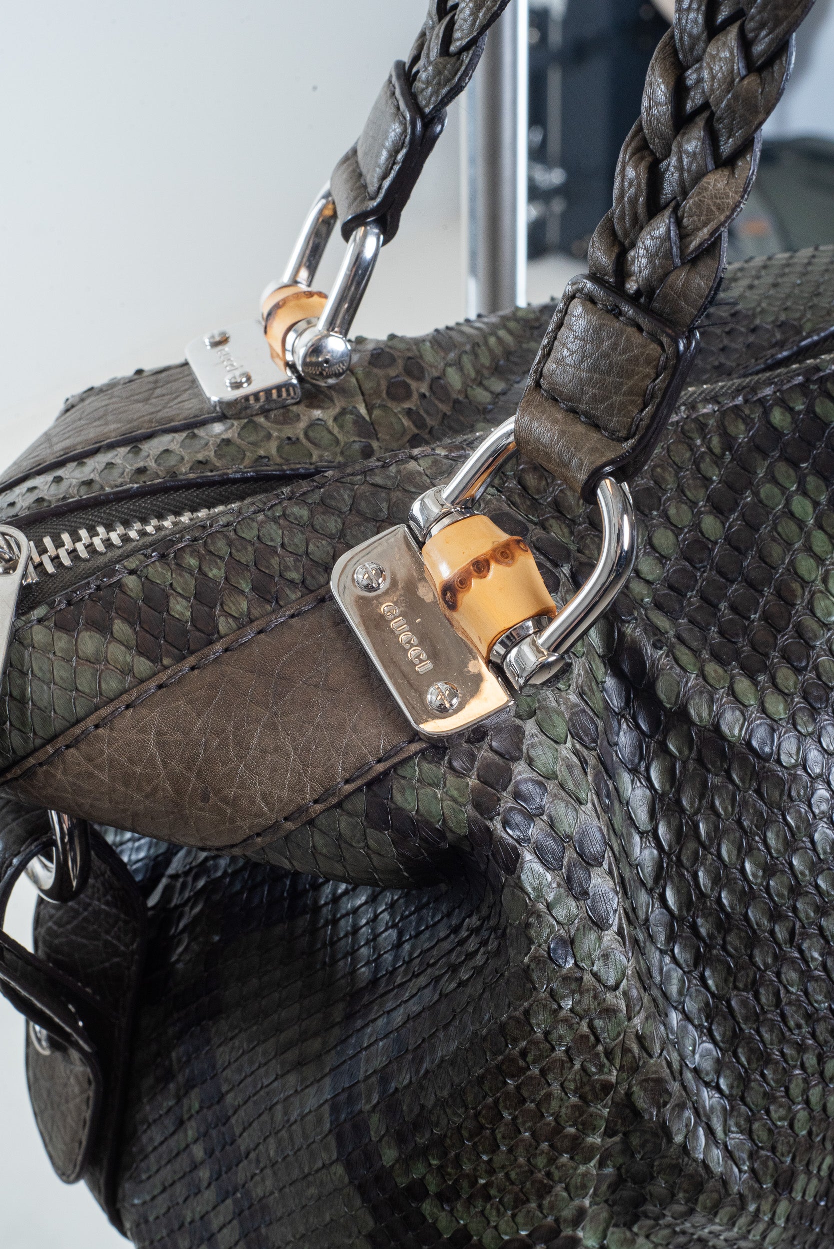 Close-up of bamboo bar detail on Gucci Python Bag