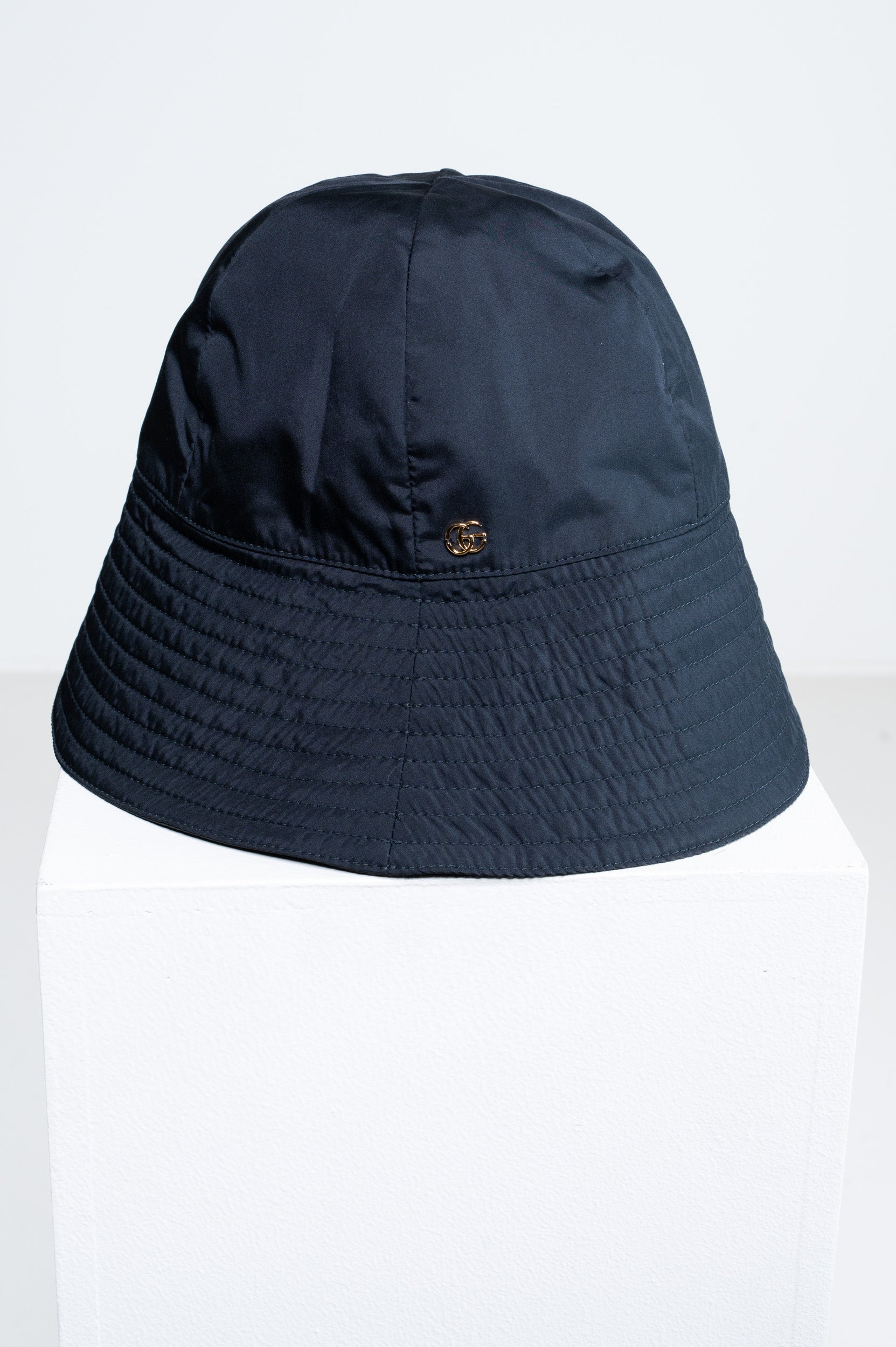 Front view of Gucci Black Nylon GG Bucket Hat with metal GG logo
