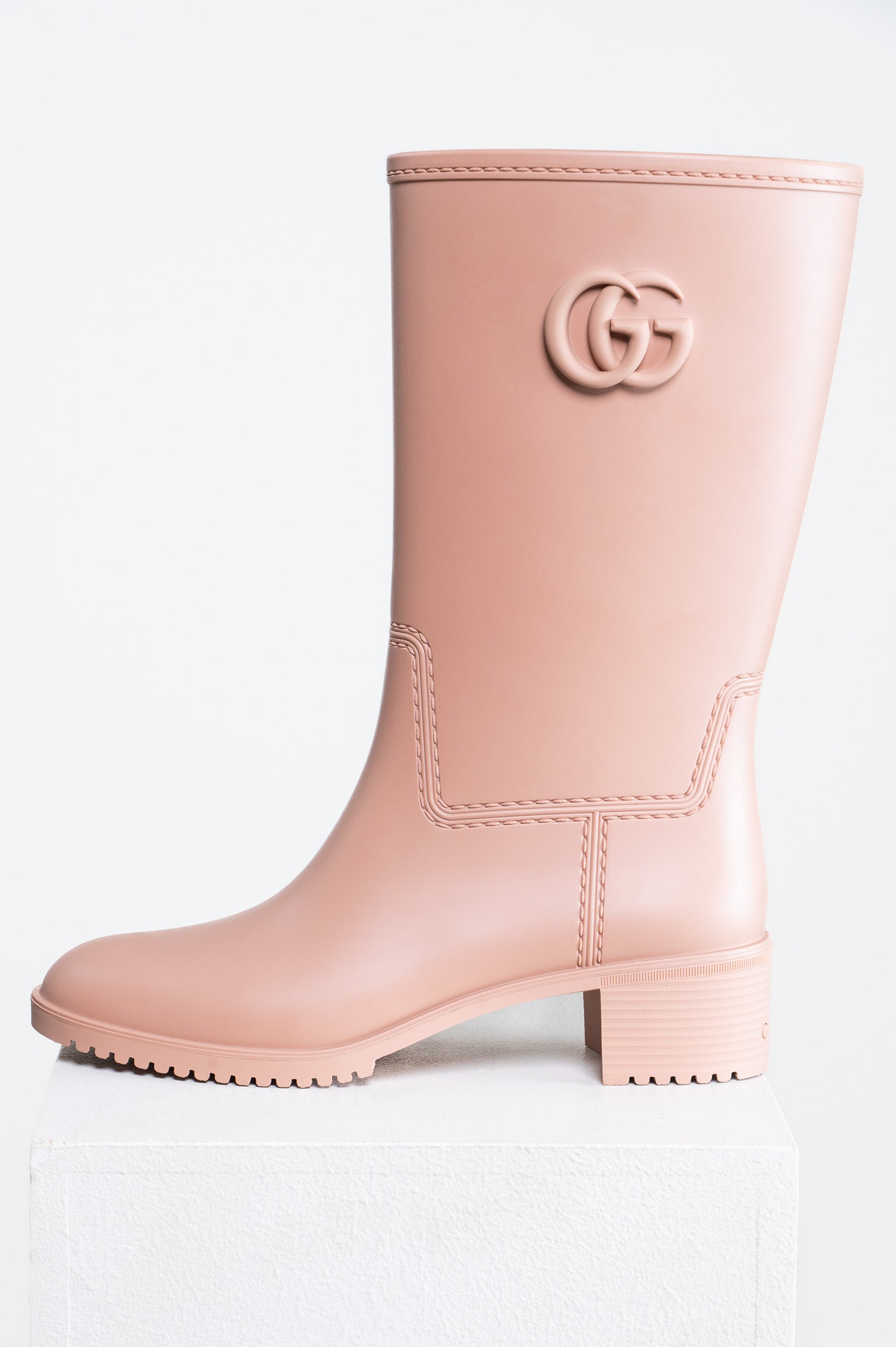 Side view of Gucci Nude Rubber GG Boots – size 8, pristine condition
