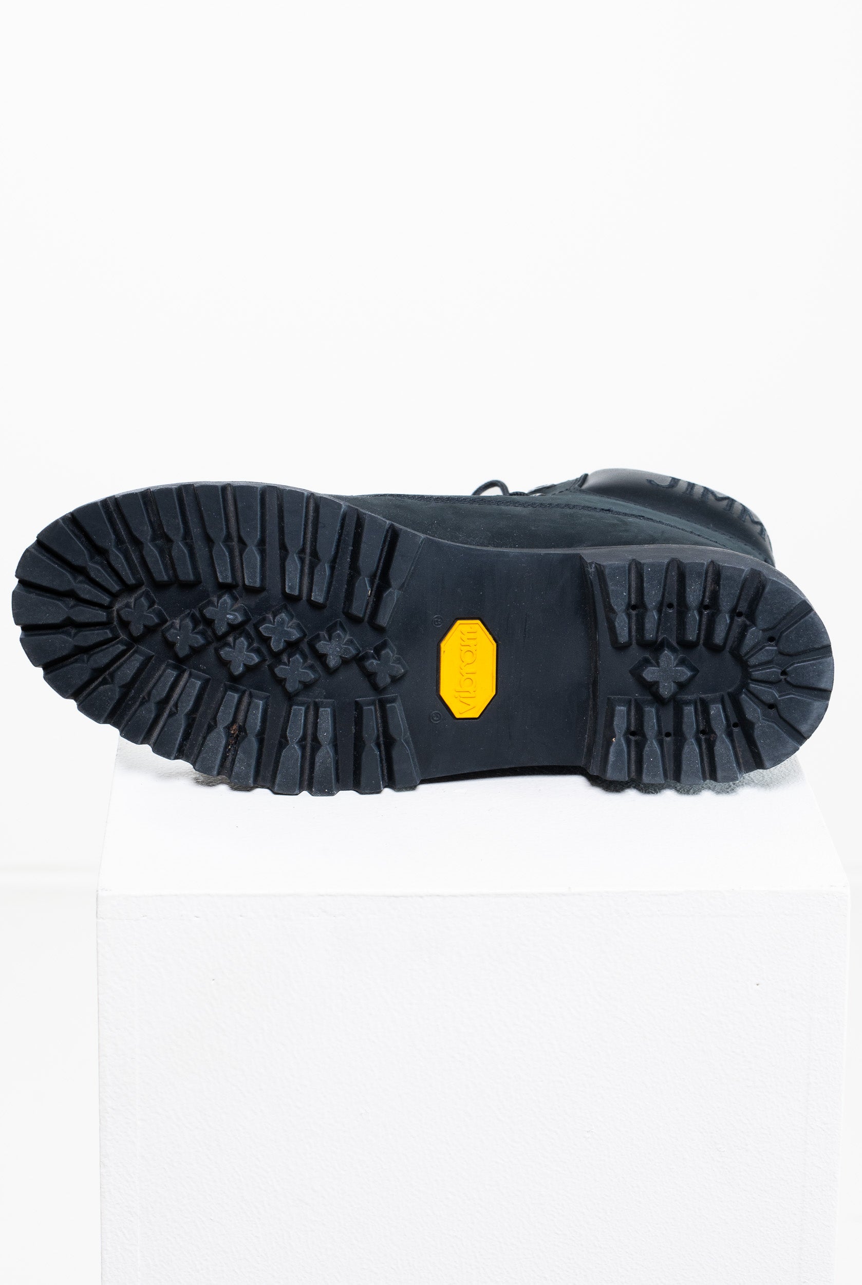 Bottom view of Vibram sole on Jimmy Choo x Timberland Combat Boot
