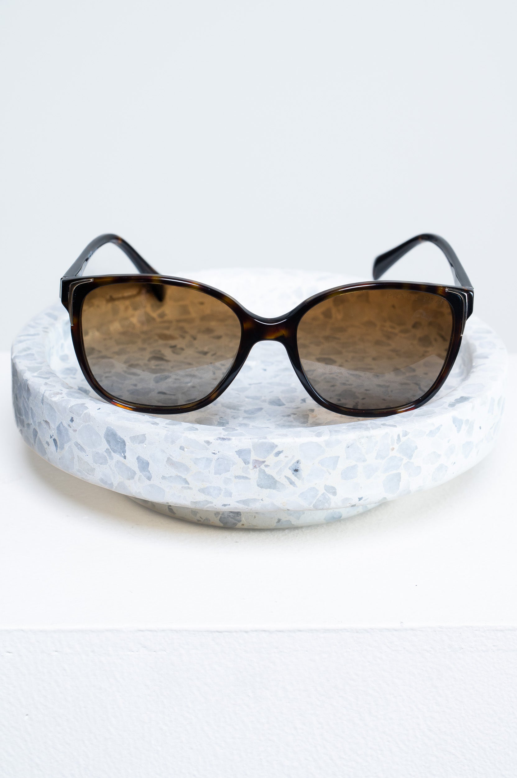 Front view of Prada Tortoise SPR 01O Sunglasses with polarized lenses