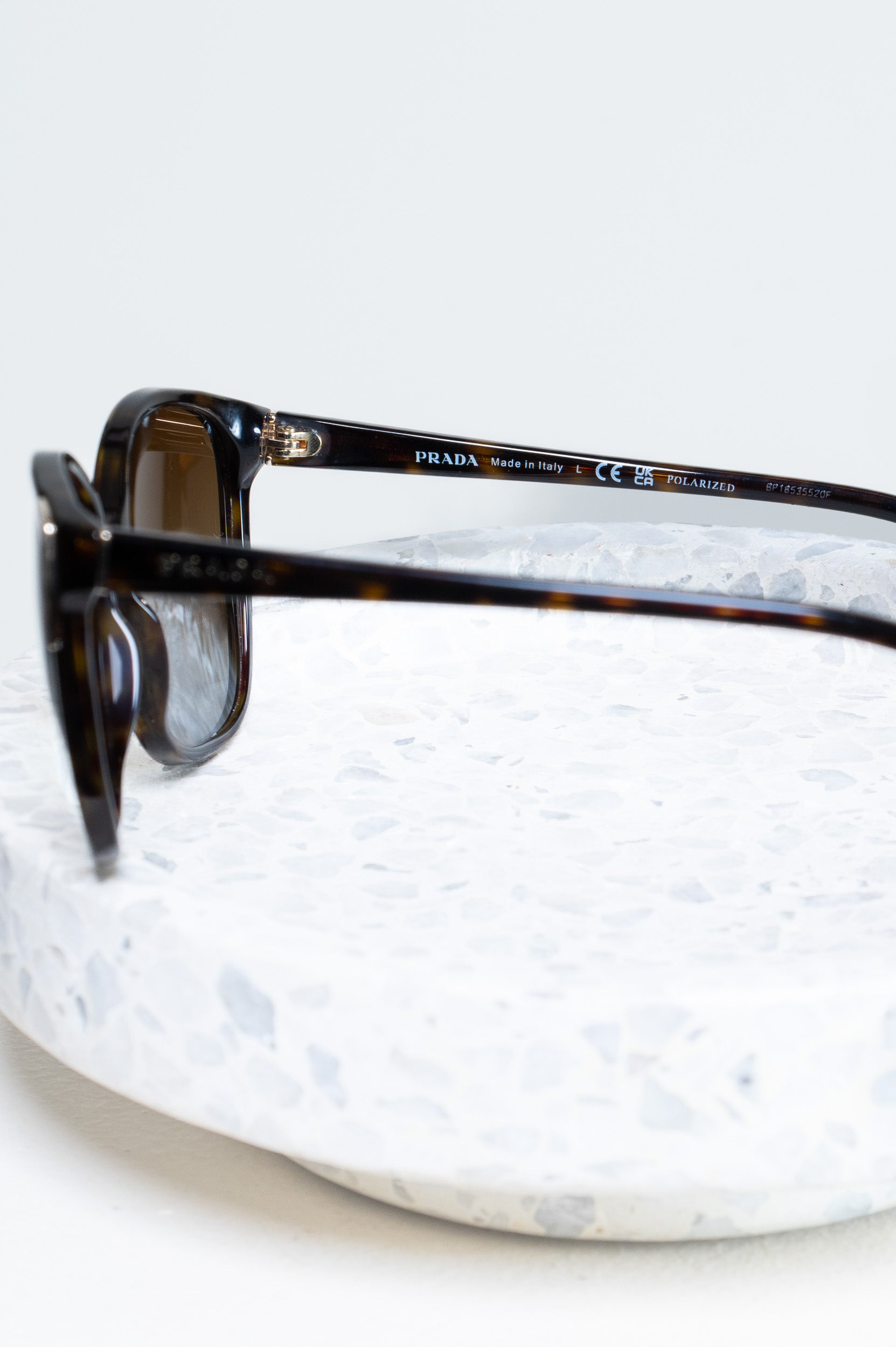 Side profile of Prada Tortoise Sunglasses showing acetate frame