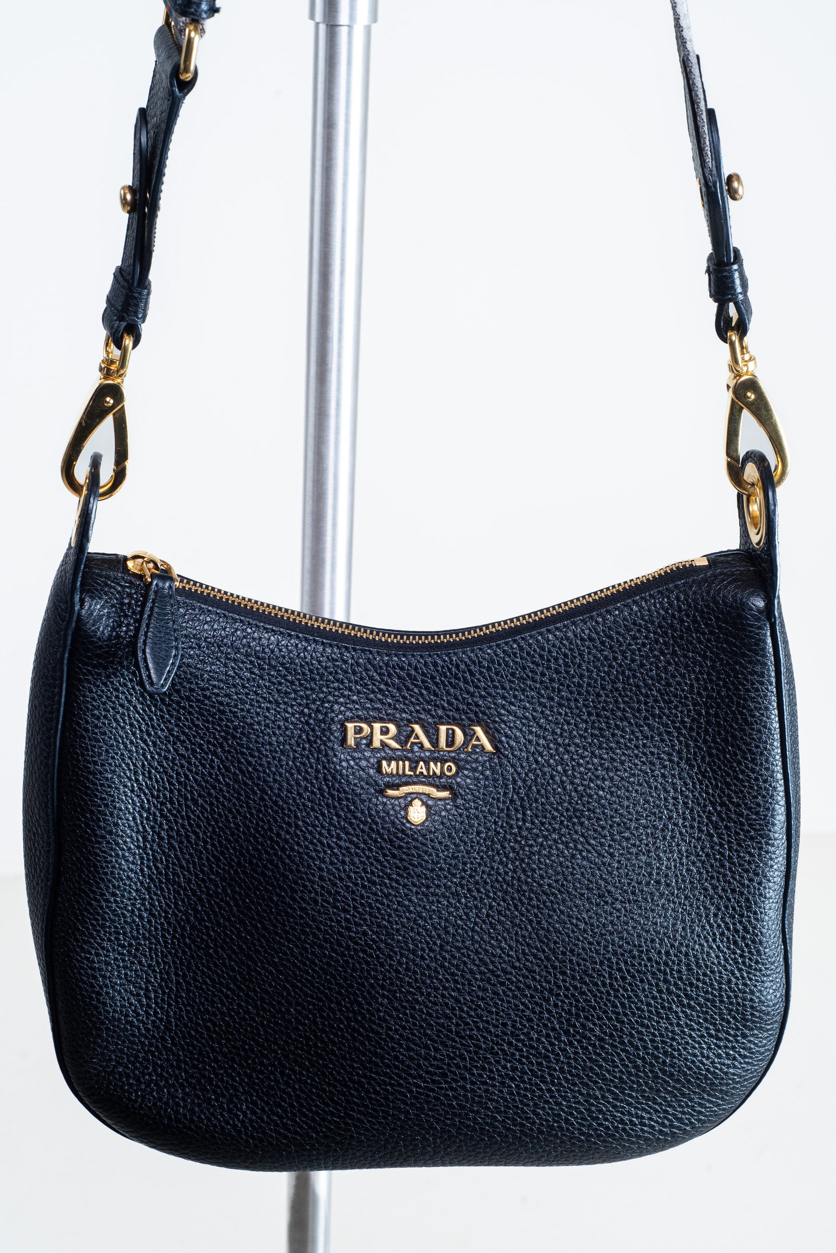 Close-up front view of the Prada Black Vitello Leather Crossbody Bag with gold-tone hardware