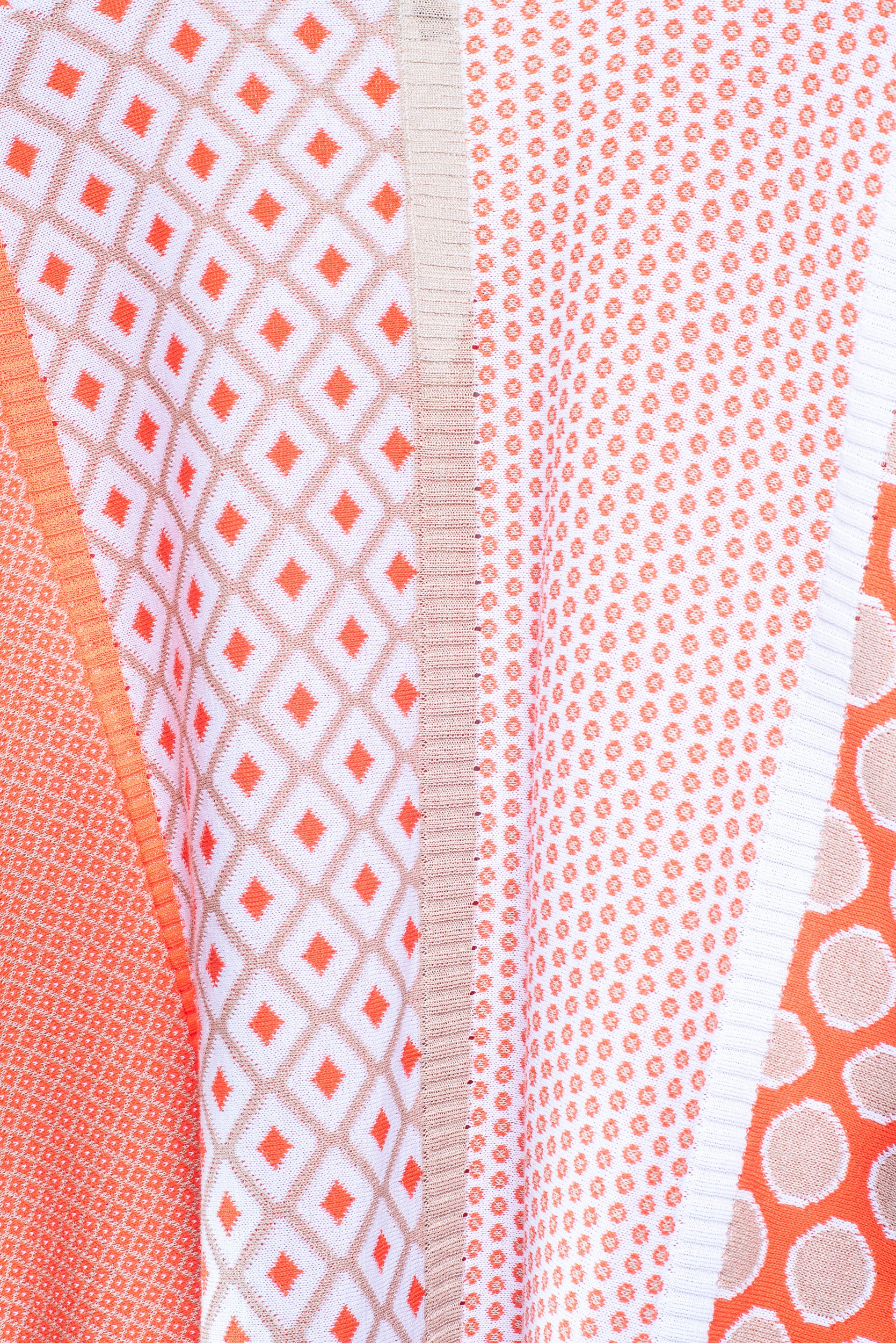 Close-up back view of Tricot Chic Orange Block Pattern Zip-Up Sweater