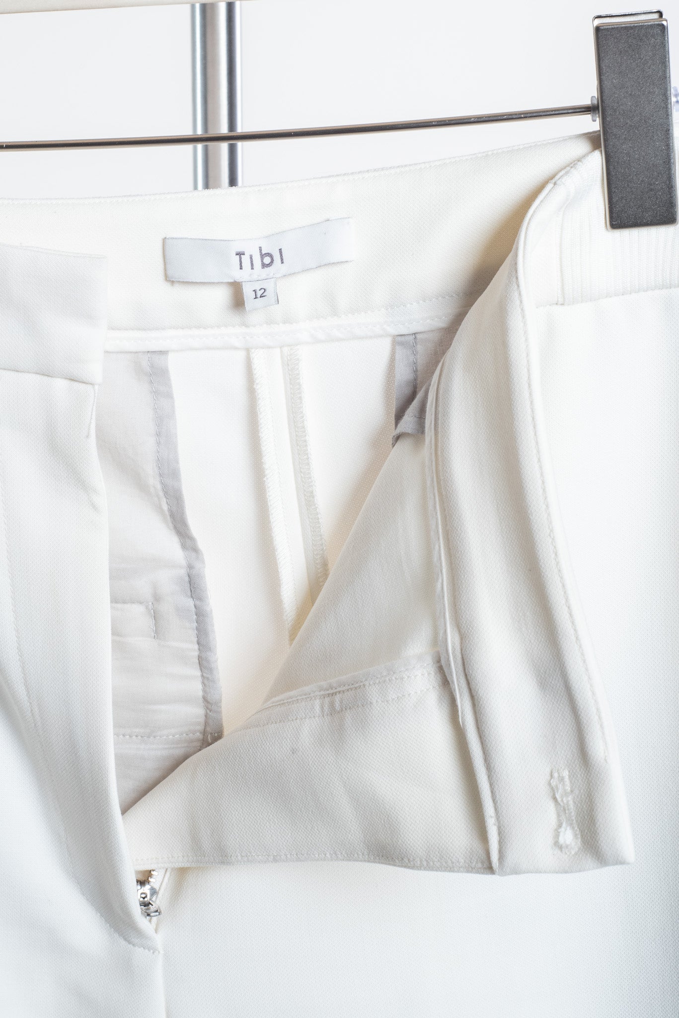 Close-up view of Tibi White Elastic Band Crop Trouser